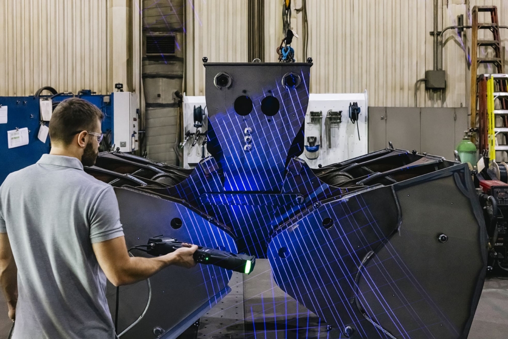 Man scanning with HandyScan 3D MAX.